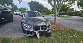 Damaged Car Found Abandoned at Hope Island Dog Park